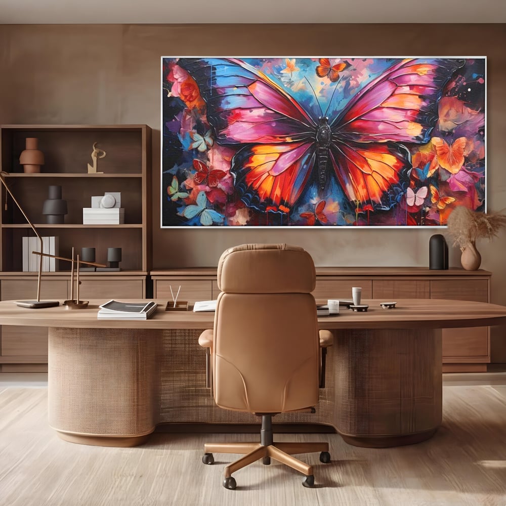 Tablou canvas cu tablou canvas cu fluture central multicolor, in rama de aluminiu argintiu, pe perete intr-un birou
